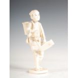 A Japanese sectional ivory okimono of a woodsman, Meiji period, 16.5cm high.