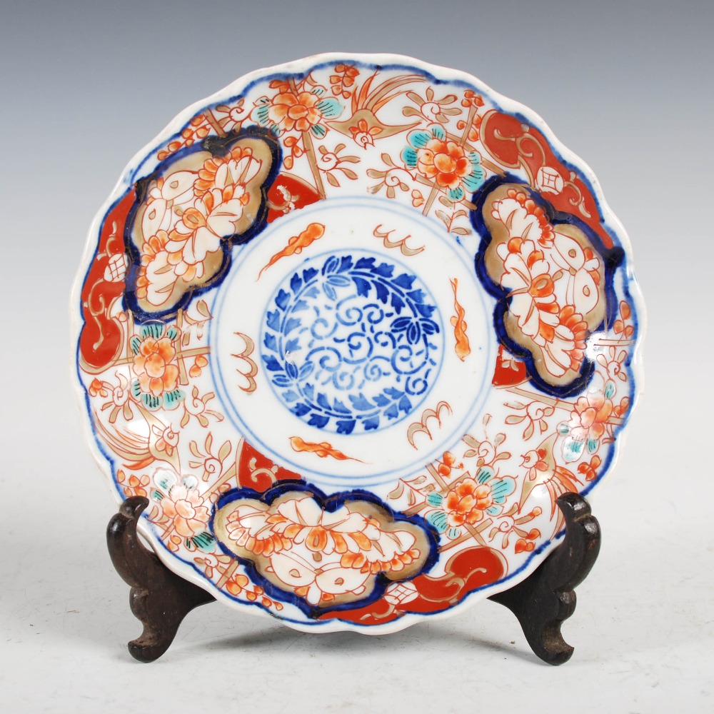 A set of three Japanese Imari plates, decorated with panels of flowers and birds, 21.5cm diameter, - Image 2 of 15