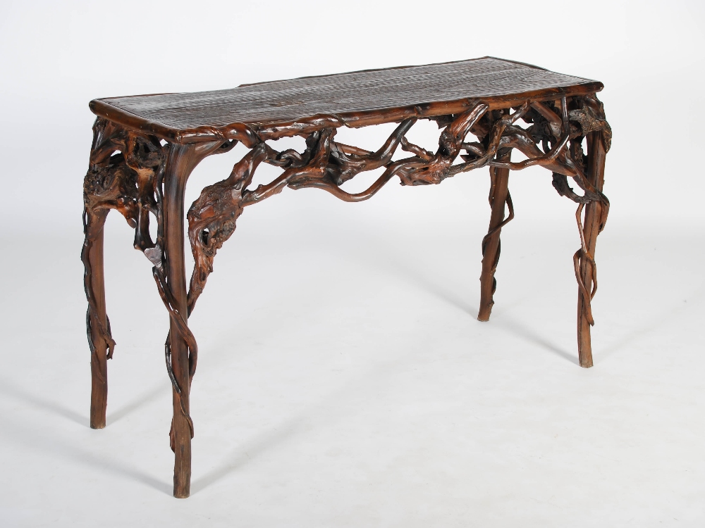 A 19th century organic branch wood console table, the rectangular planked top above an entwined