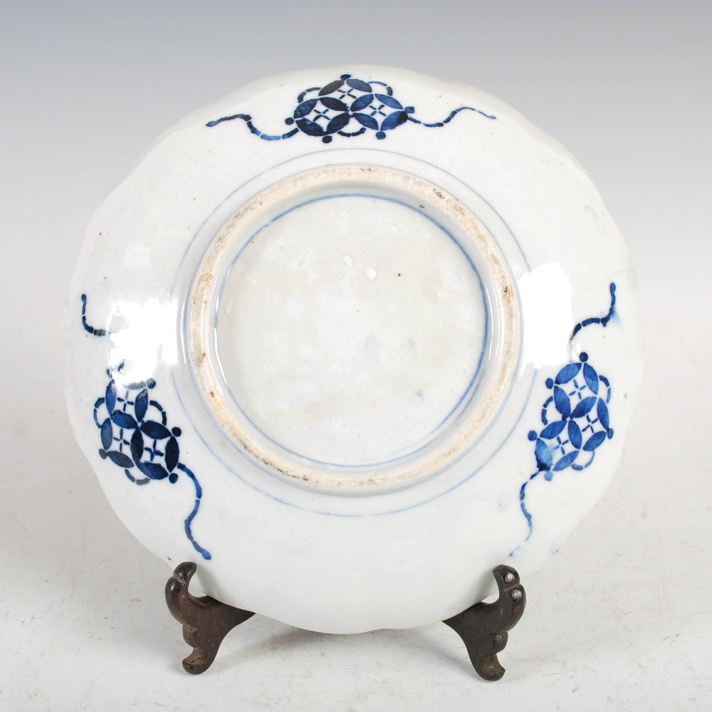 A set of three Japanese Imari plates, decorated with panels of flowers and birds, 21.5cm diameter, - Image 10 of 15