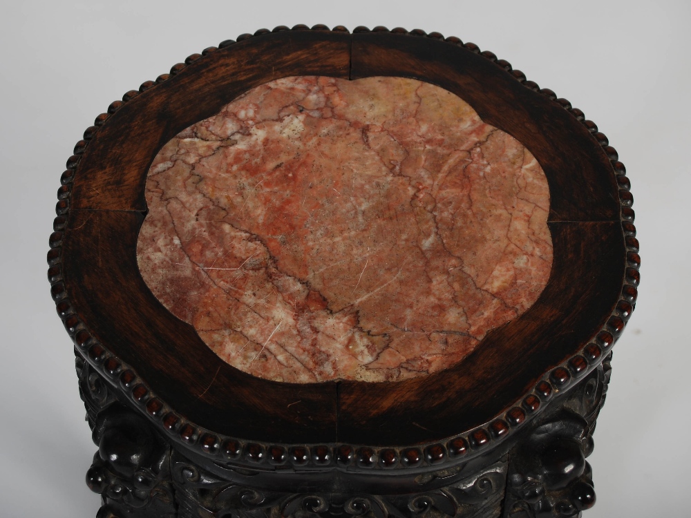 A Chinese dark wood jardiniere stand, late Qing Dynasty, the shaped octagonal top with a mottled red - Image 3 of 5