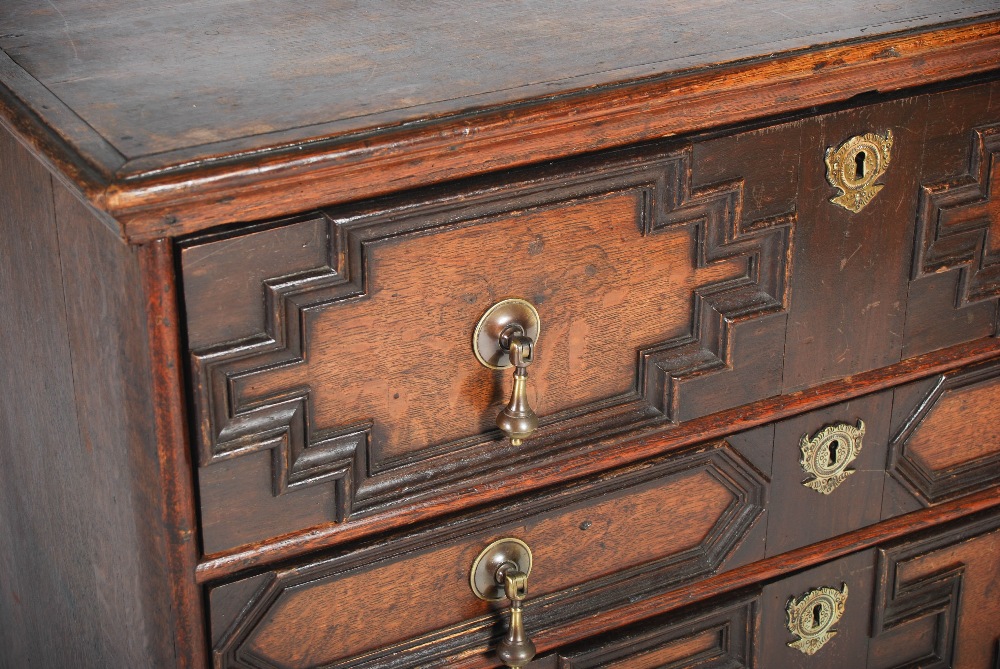 A Charles II style oak chest, the rectangular top with a moulded edge above four long drawers with - Image 3 of 5