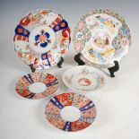 A Japanese Imari plate, of lobbed circular form decorated with flowers and foliage, 21.5cm diameter,