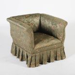 A Victorian mahogany square shaped armchair, the floral upholstered back, arms and seat raised on