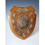 An Edwardian electroplated and silver mounted shield shaped trophy, The Ward Challenge Shield