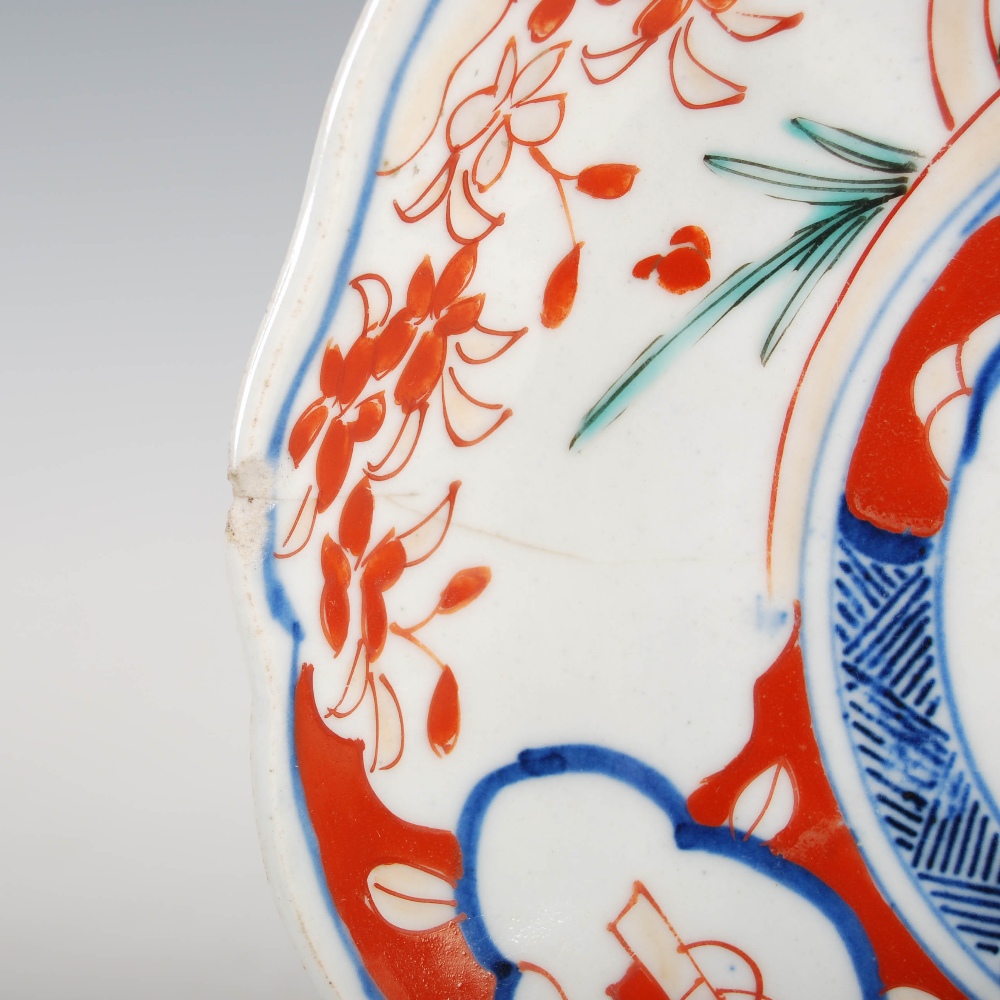 A set of three Japanese Imari plates, decorated with panels of flowers and birds, 21.5cm diameter, - Image 9 of 15