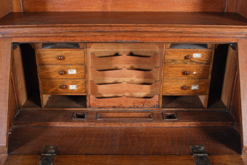 An oak Arts & Crafts style bureau bookcase, the moulded cornice above a plain frieze centred with - Image 2 of 7