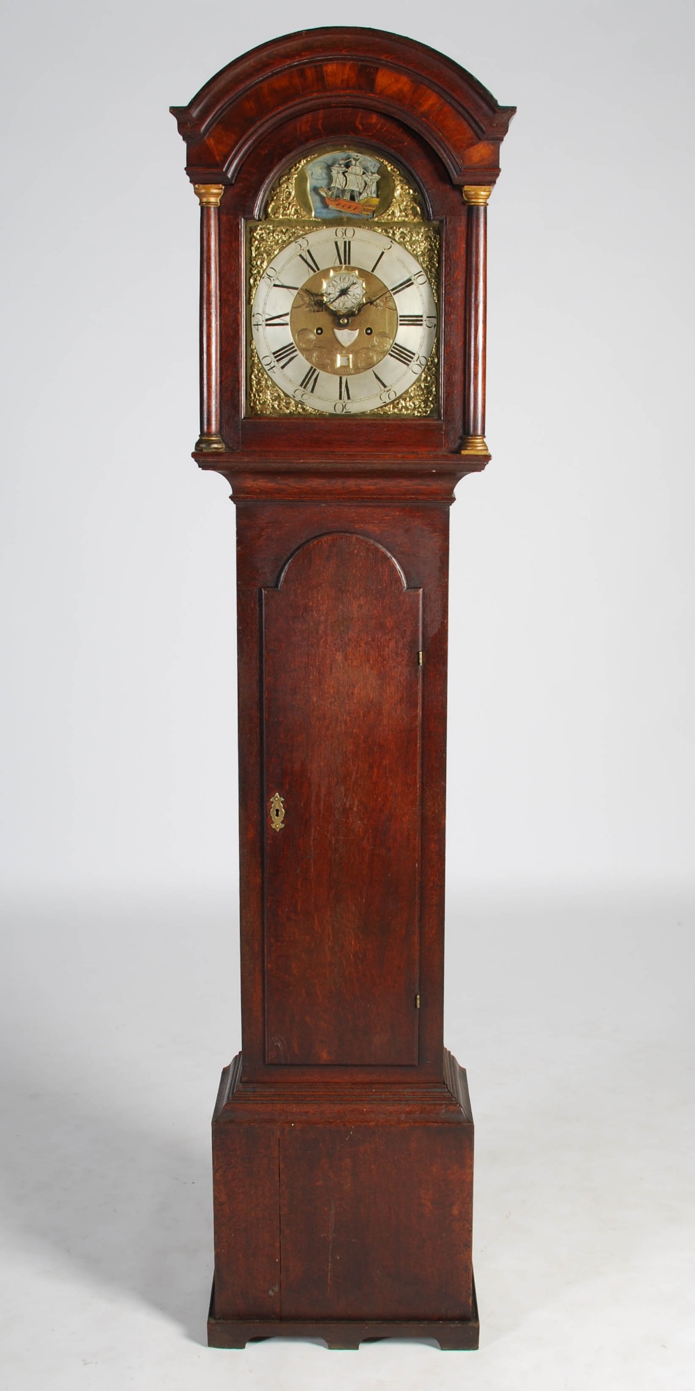 An 18th century oak automata longcase clock, I.P., the brass dial with silvered chapter ring bearing