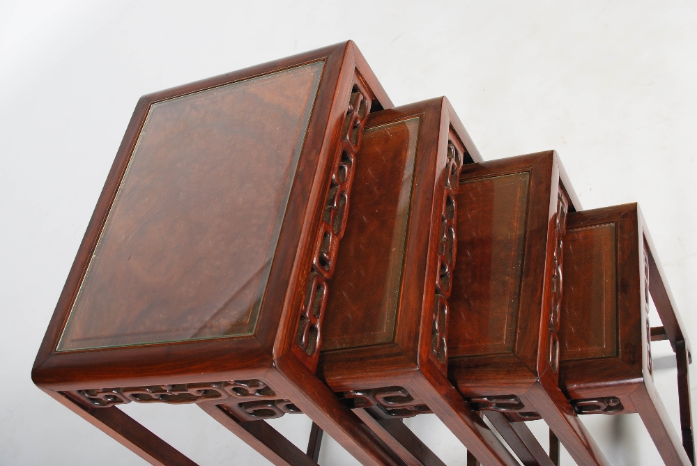A quartetto of four Chinese dark wood occasional tables, late Qing Dynasty, the rectangular tops - Image 3 of 3