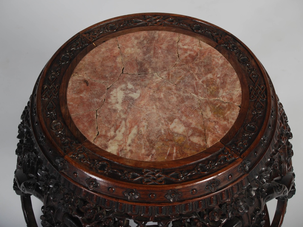 A Chinese dark wood barrel shaped jardiniere stand, Qing Dynasty, the circular top with a mottled - Image 3 of 5