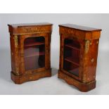 A pair of 19th century walnut, marquetry inlaid and gilt metal mounted pier cabinets, the