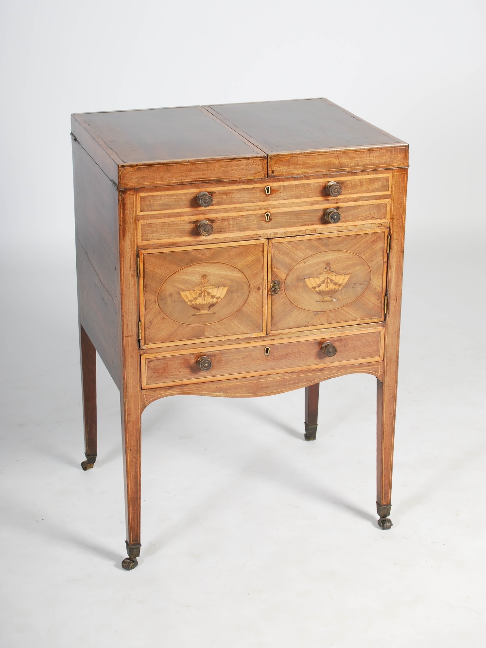 A George III mahogany and satinwood banded wash stand, the hinged rectangular top opening to a