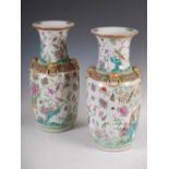 A pair of Chinese porcelain famille rose Canton vases, Qing Dynasty, decorated with peony, rock