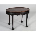 A George III style Irish mahogany silver table, the oval shaped top with a slightly dished edge,