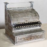 A vintage National Cash Register, with scroll and foliate cast decoration, 43cm wide x 44.5cm high x