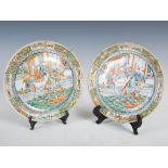 A pair of Chinese porcelain famille rose plates, Qing Dynasty, decorated with officials and