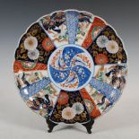 A late 19th/early 20th century Japanese Imari charger, centred with a circular roundel enclosing