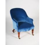 A 19th century rosewood armchair, the blue velvet upholstered back, arms and serpentine seat