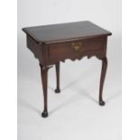 A George III mahogany lowboy, the rectangular top with a moulded edge above a single cockbeaded