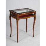 A late Victorian rosewood, marquetry inlaid and gilt metal mounted bijouterie table, the hinged