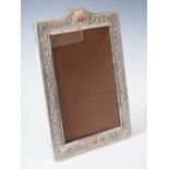 A late 19th/early 20th century Indian white metal photograph frame of large size, the border