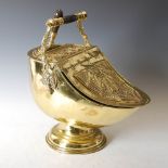 An early 20th century brass coal scuttle in the Neo Classical taste, with hinged cover and