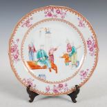 A Chinese famille rose porcelain plate, Qing Dynasty, decorated with seven figures within a diaper