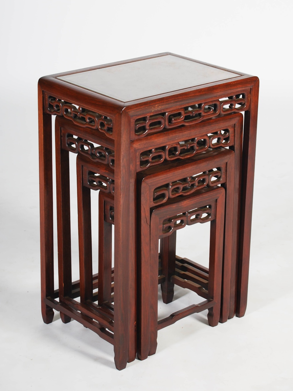 A quartetto of four Chinese dark wood occasional tables, late Qing Dynasty, the rectangular tops