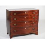 A George III mahogany and boxwood lined serpentine chest, the shaped rectangular top above four long