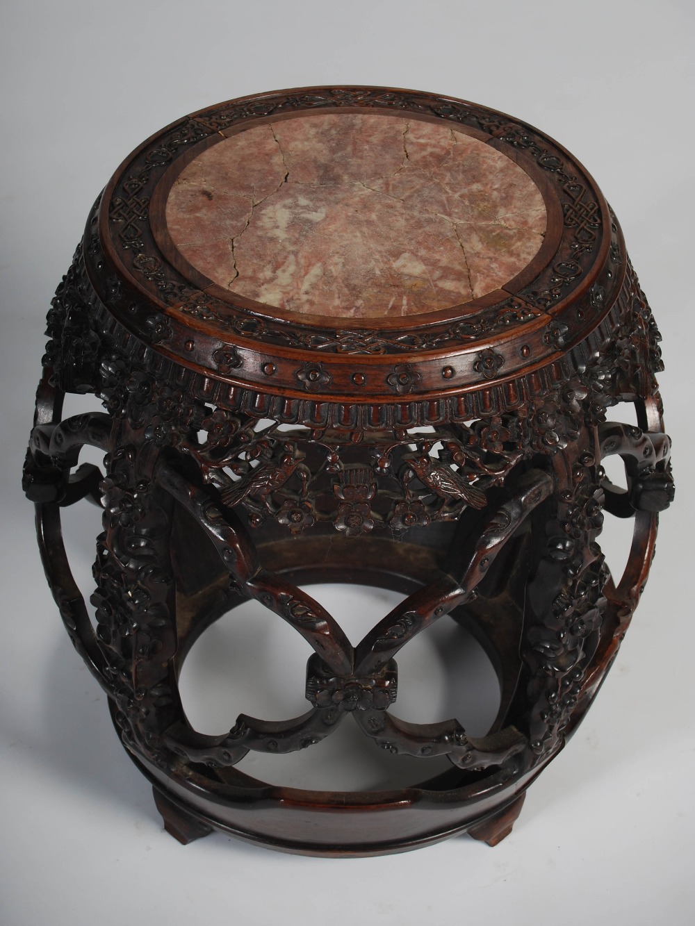 A Chinese dark wood barrel shaped jardiniere stand, Qing Dynasty, the circular top with a mottled - Image 2 of 5