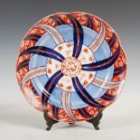 A Japanese porcelain Imari dish, early 20th century, of lobbed circular form decorated with a