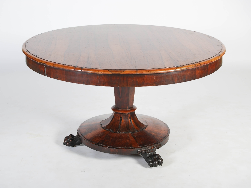 A 19th century rosewood snap top dining table, the hinged circular top raised on a tapered octagonal - Image 3 of 6