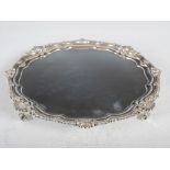 An Edwardian silver salver, London, 1901, makers mark of GH, with beaded and shell cast rim,