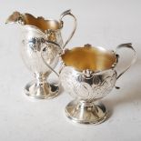 An American Sterling silver Art Nouveau twin handled sugar basin and cream jug, New York, circa