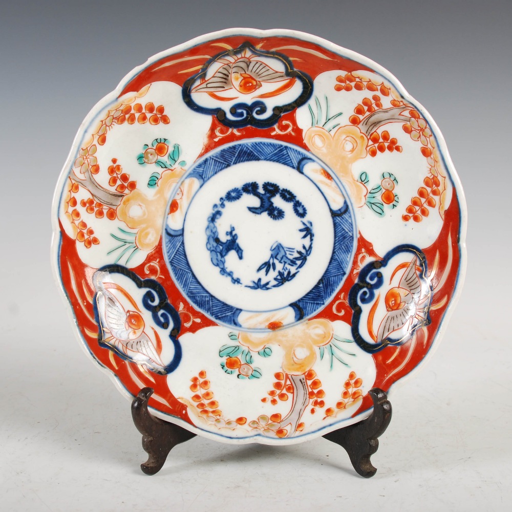 A set of three Japanese Imari plates, decorated with panels of flowers and birds, 21.5cm diameter, - Image 14 of 15