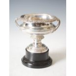 A George V silver twin handled footed bowl, London 1912. makers mark AR, the rim chased with