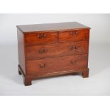A George III mahogany chest, the rectangular top with a moulded edge, above two short and two long
