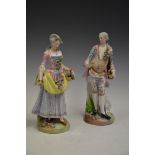PAIR OF MEISSEN PORCELAIN FIGURES - MALE AND FEMALE HOLDING BASKETS OF FLOWERS, BLUE CROSSED