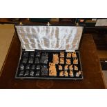 EARLY 20TH CENTURY INDIAN SANDALWOOD AND EBONISED CHESS SET IN FITTED CASE