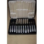 CASED SET OF SIX ELECTROPLATED AND MOTHER OF PEARL HANDLED FRUIT KNIVES AND FORKS