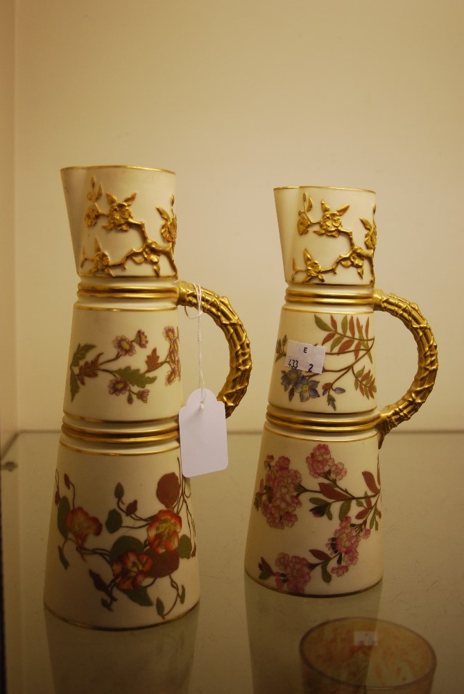 PAIR OF LATE 19TH CENTURY ROYAL WORCESTER IVORY GROUND CONICAL SHAPED JUGS, PUCE MARKS