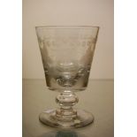 A 19TH CENTURY GLASS RUMMER ENGRAVED WITH FRUITING VINE AND RECTANGULAR INITIAL PANEL