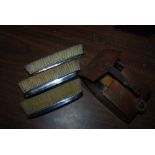 LEATHER CASED PAIR OF LONDON SILVER BACKED GENTLEMAN'S BRUSHES INSCRIBED WITH ARMORIAL CREST '
