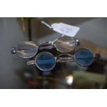 PAIR OF ANTIQUE SILVER SPECTACLES, TOGETHER WITH A PAIR OF WHITE METAL SPECTACLES WITH BLUE TINTED