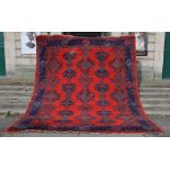 A late 19th/ early 20th century red ground Ushak carpet, 460cm x 376cm