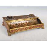 A late 19th century boulle work desk stand, with rectangular lidded compartment flanked by two glass