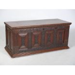 A 19th century Continental oak and ebony inlaid baroque style coffer, the hinged rectangular top