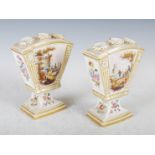 A pair of late 19th century Continental porcelain bulb pots, painted with panels of figures before