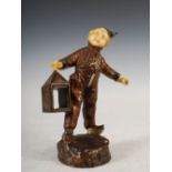 An early 20th century bronze and ivory figure of a boy holding a lantern after George Omerth, 13cm