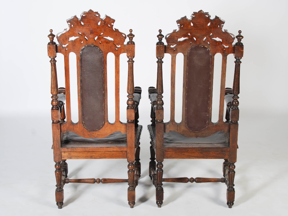 A pair of late Victorian oak armchairs, the top rails carved with shields flanked by lions above - Image 4 of 4